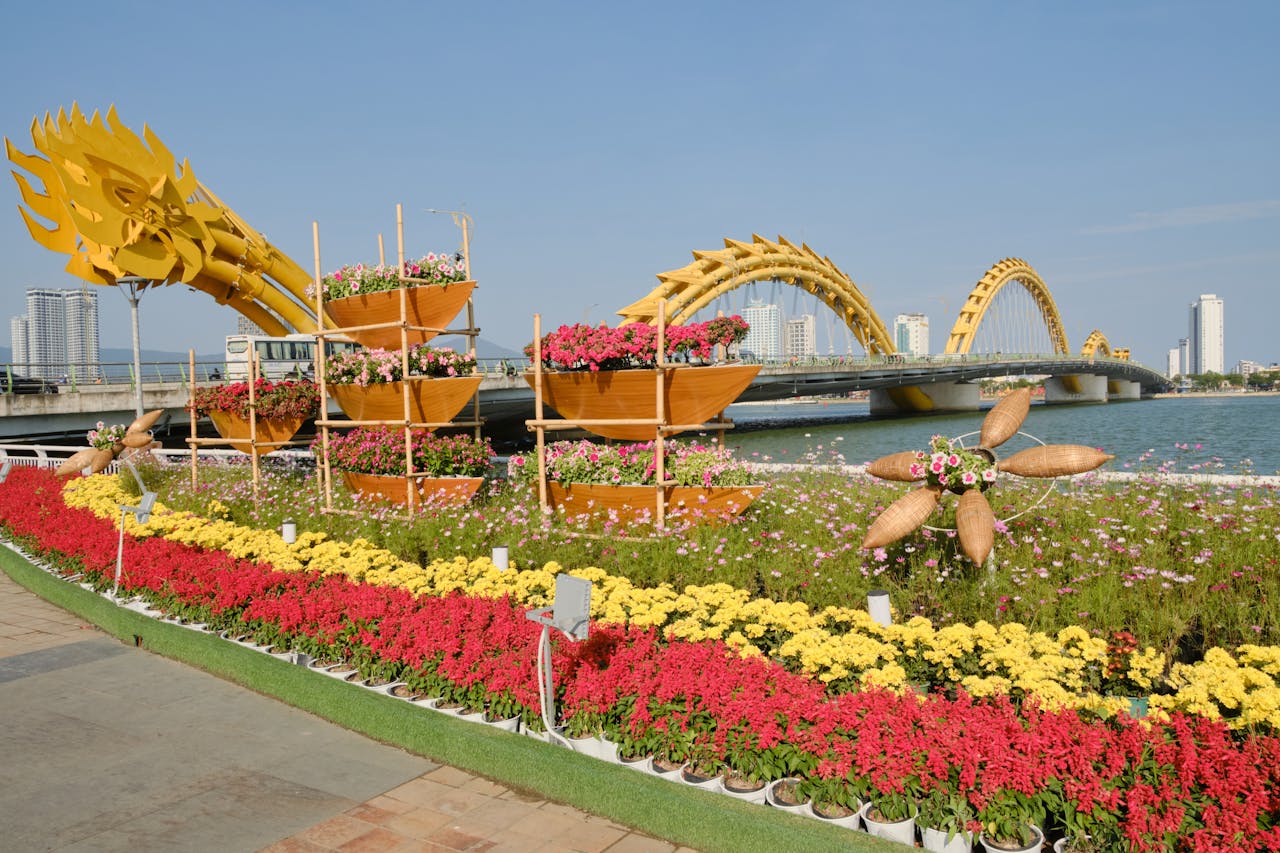 Stunning view of Dragon Bridge adorned with vibrant flower arrangements in Da Nang, Vietnam.